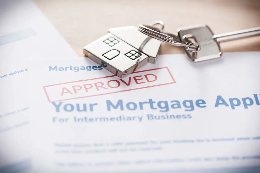 House keys and mortgage approval document