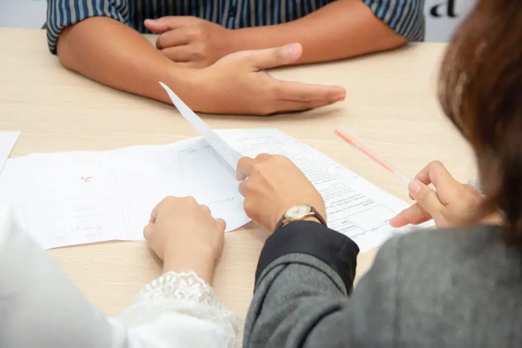 people reviewing documents