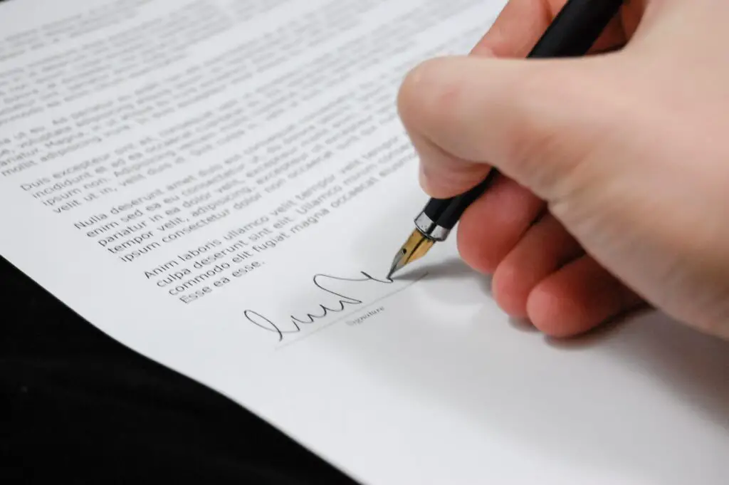 A man signing documents