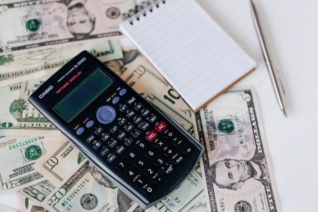 A calculator on top of cash