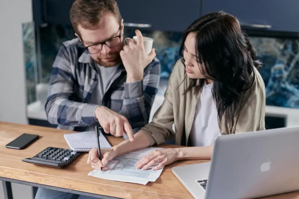 Man and woman looking at their financials