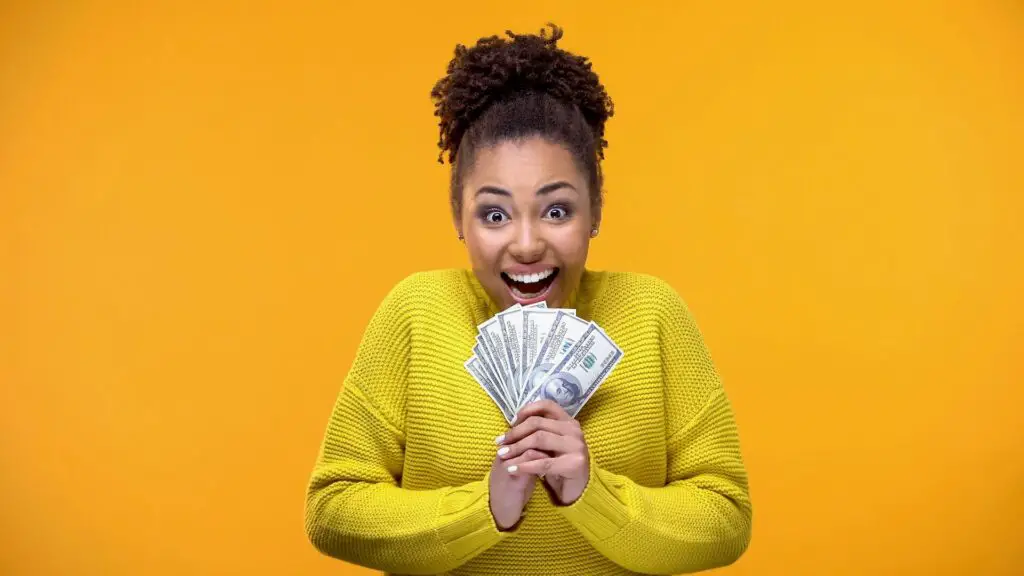 A woman holding cash
