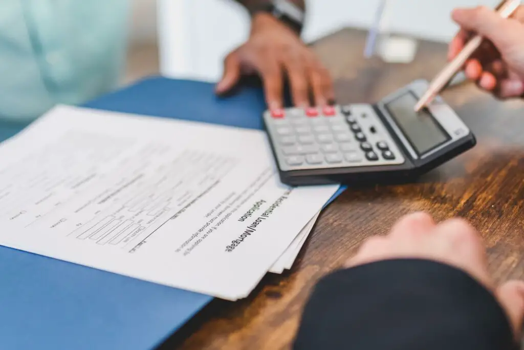 Two people calculating a loan