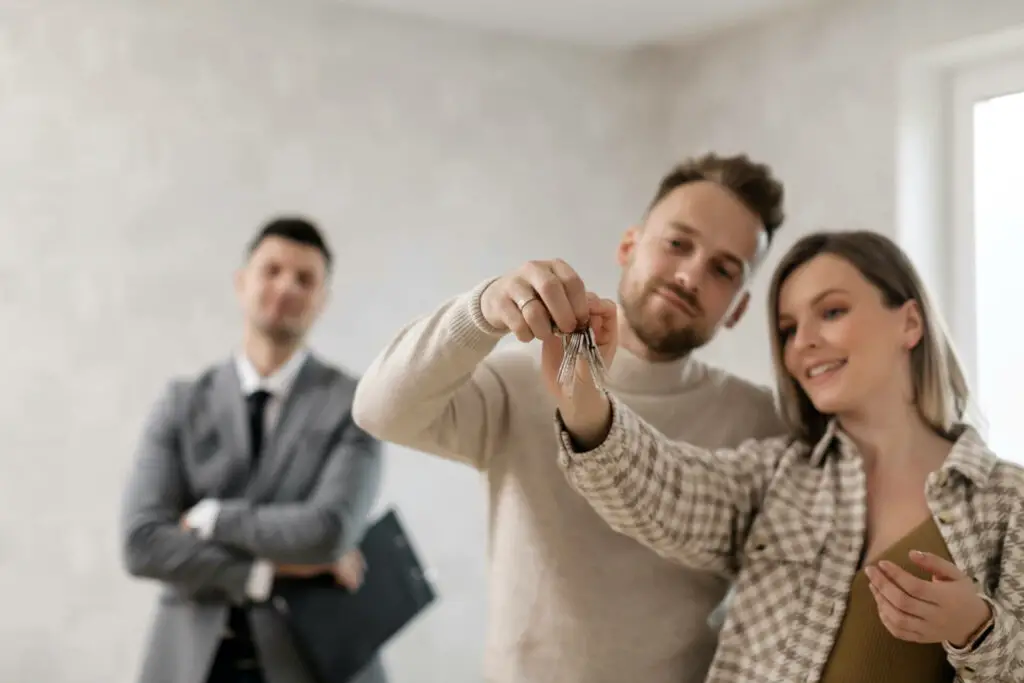 A couple holding their home key