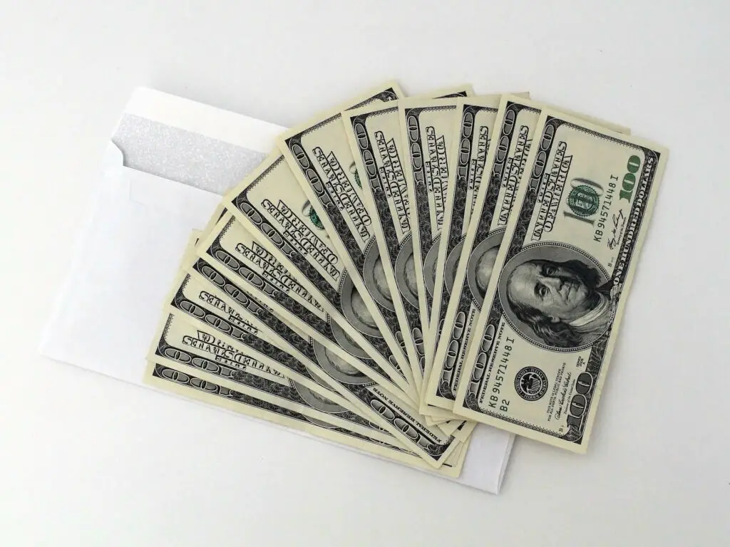 A pile of dollars on a white background