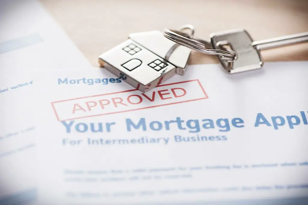 An approved mortgage document and a house-shaped keychain