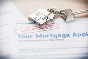 An approved mortgage document and a house-shaped keychain