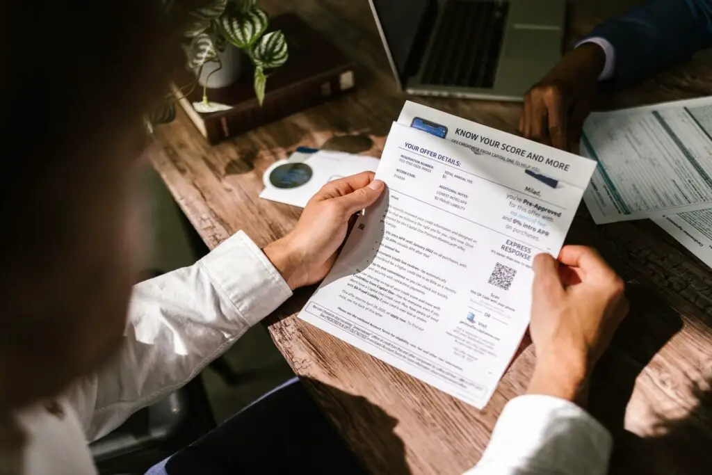 A man holding a letter of approval