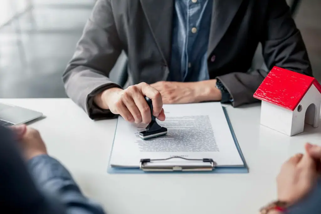 A loan officer approving a home mortgage loan to clients