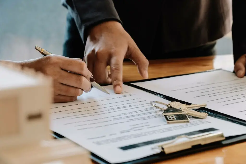 Signing a document for buying a house