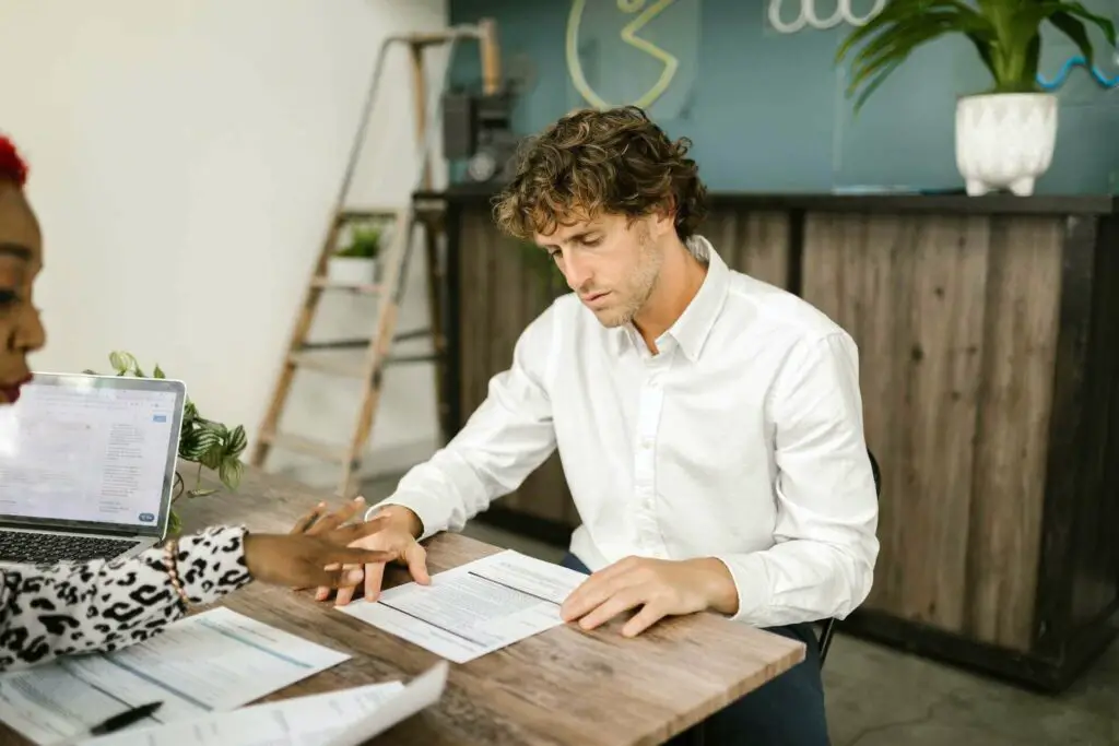 Man looking at the contracts 