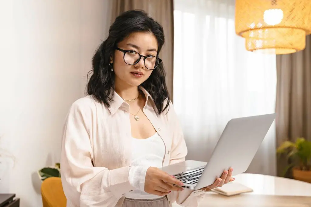  A woman carrying a laptop