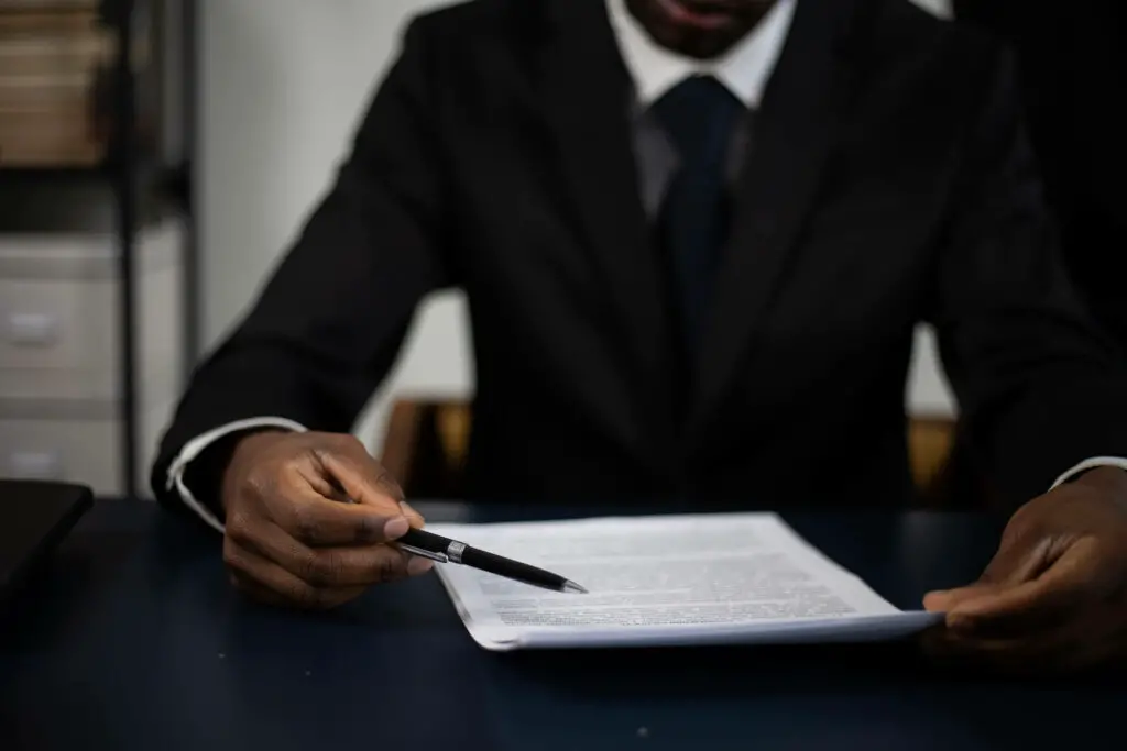 A man holding a pile of papers