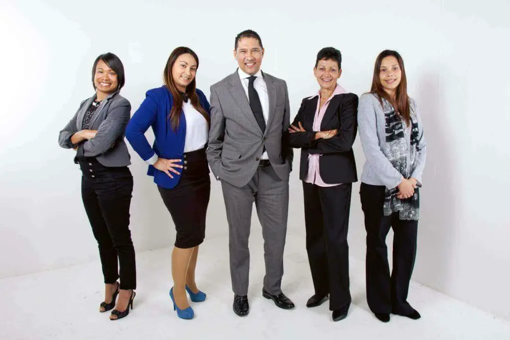 Group of people standing and smiling