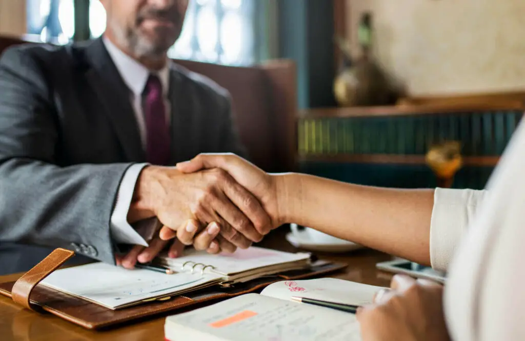 Man and a woman shaking hands