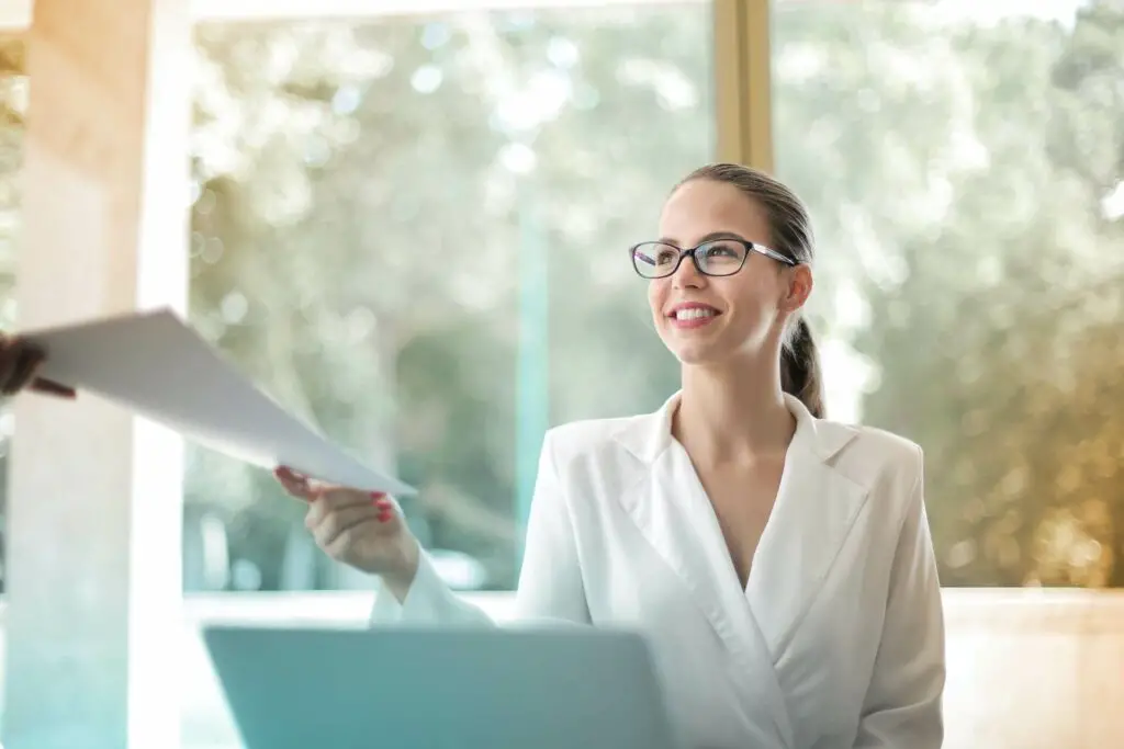 Woman handing out paperwork