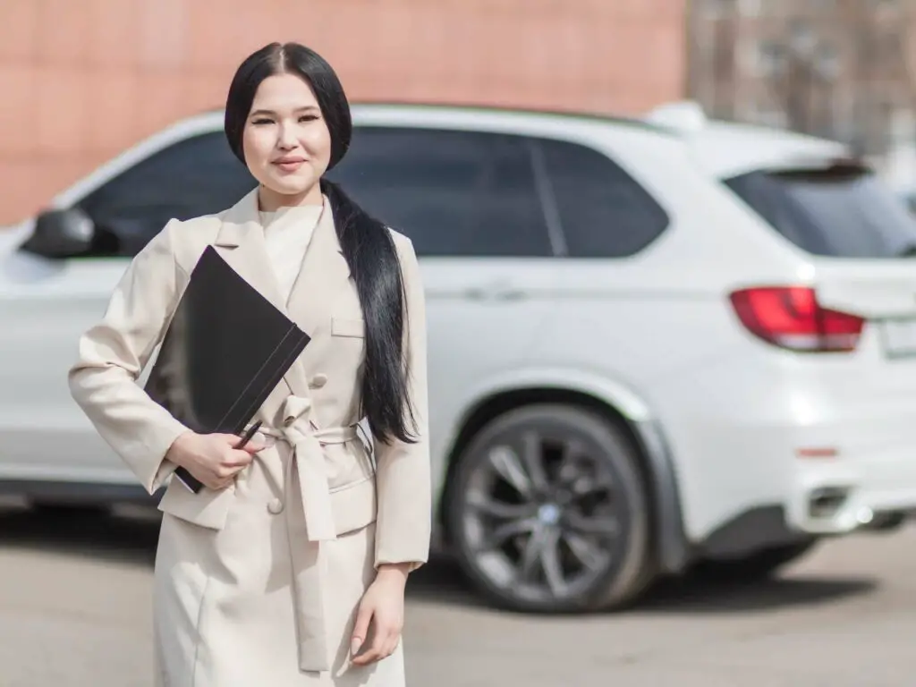 Woman holding a black folder