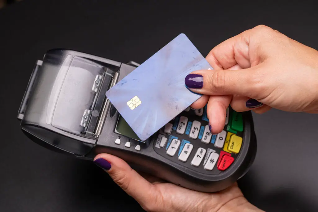 A woman paying with a card